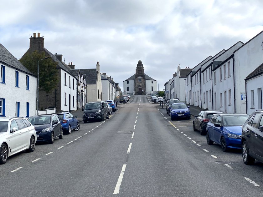The round Kilarrow Church casts a stern eye over Bowmore's Main Street
