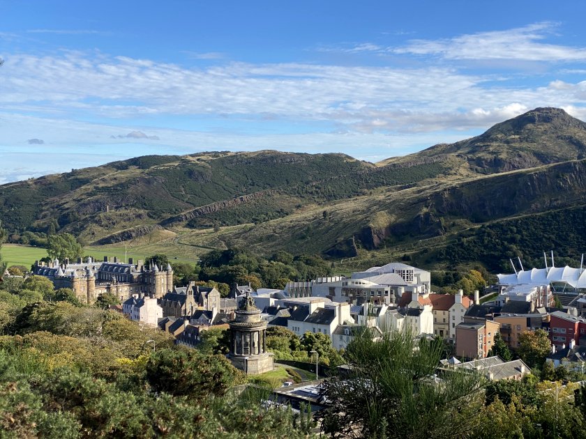 View towards Holyrood, with both palace and parliament. Also included is Edinburgh's Burns Monument.
