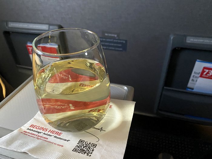 Glass of wine on the JFK-CLT (Boeing 737-800, Seat 1C)