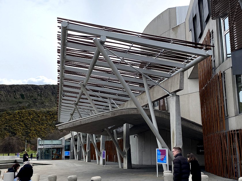 Nearby is the Scottish Parliament, with the Salisbury Crags in the background